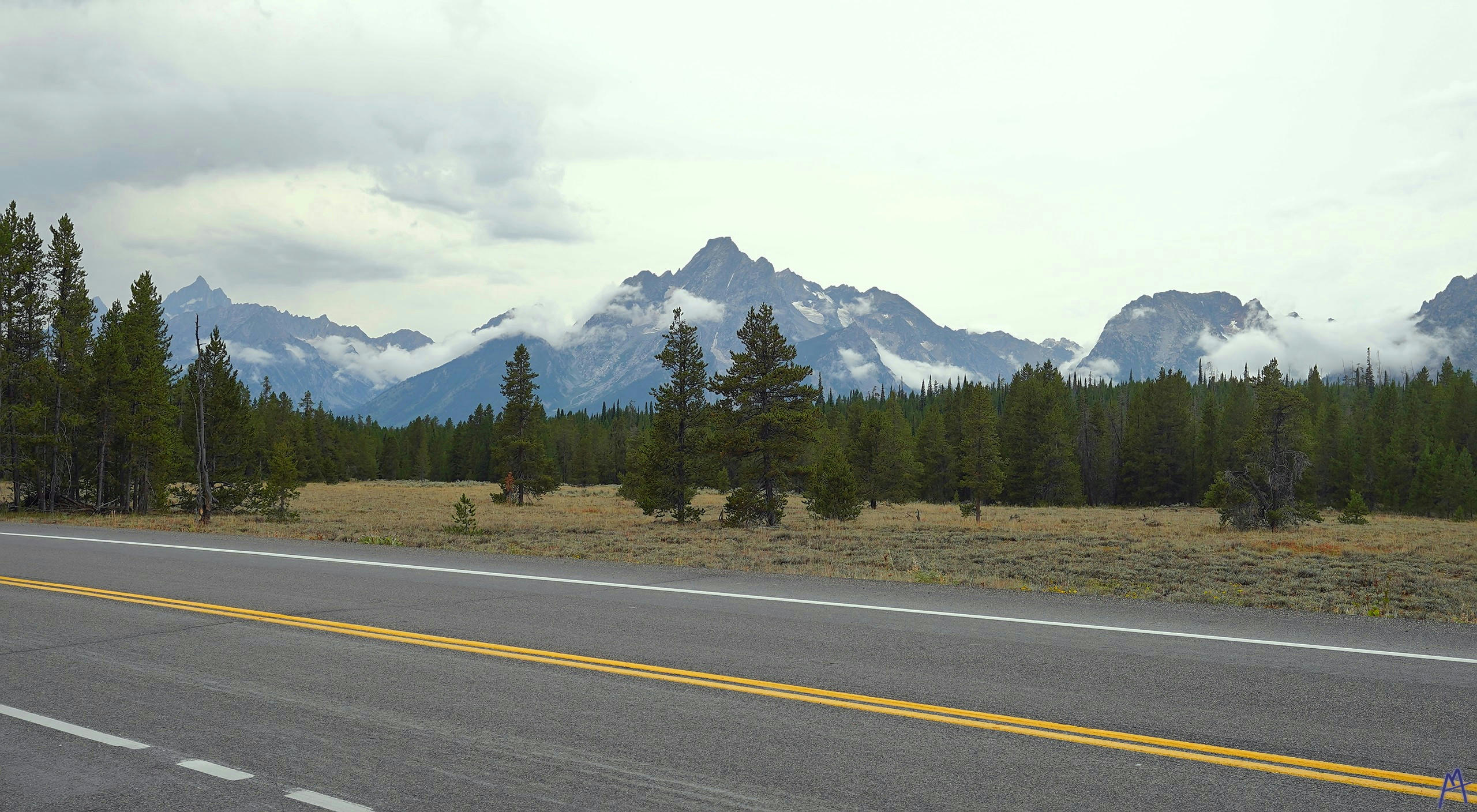 View of the mountains from a road at Grand Teton