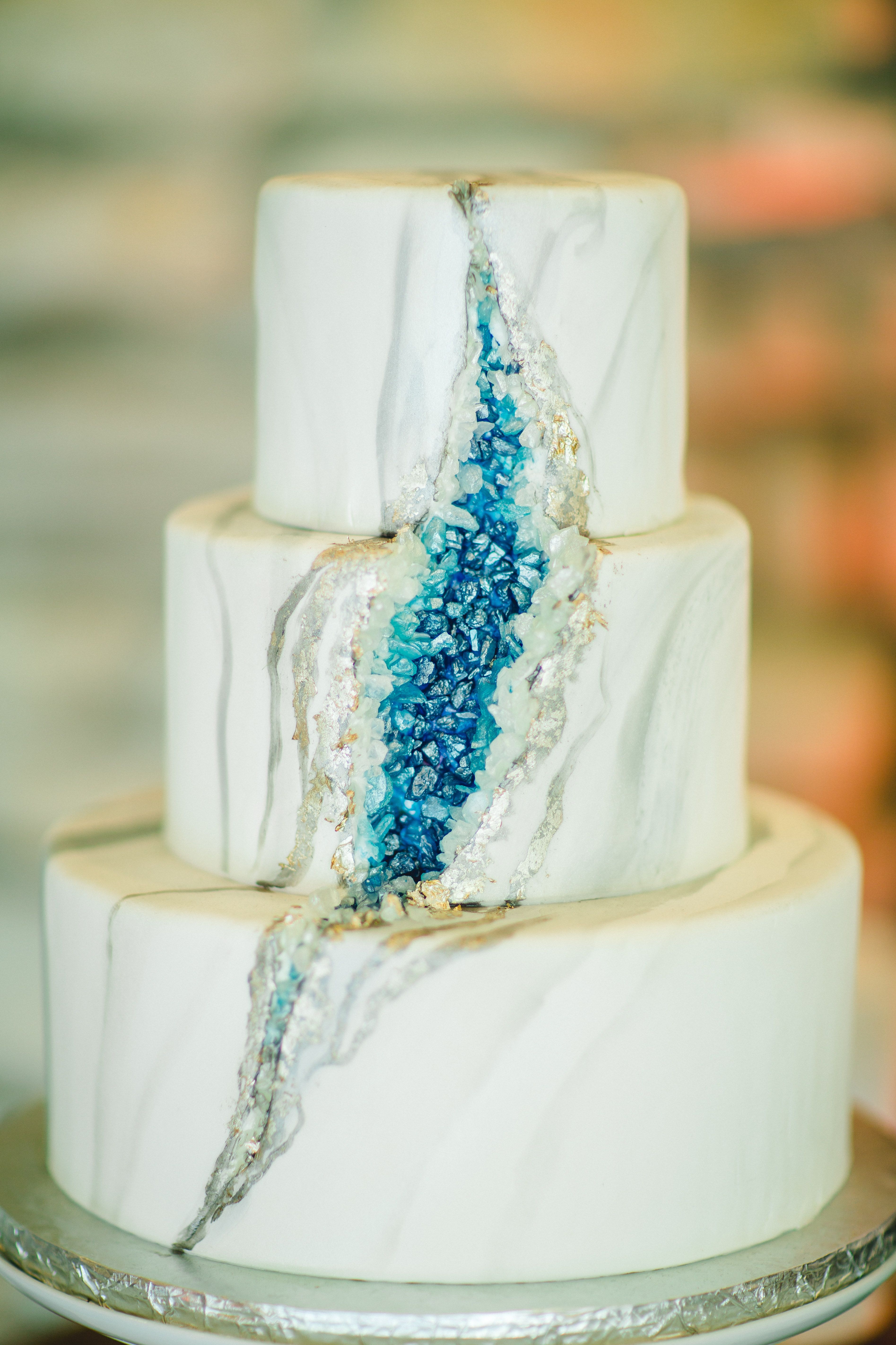 A wedding cake with a geode pattern