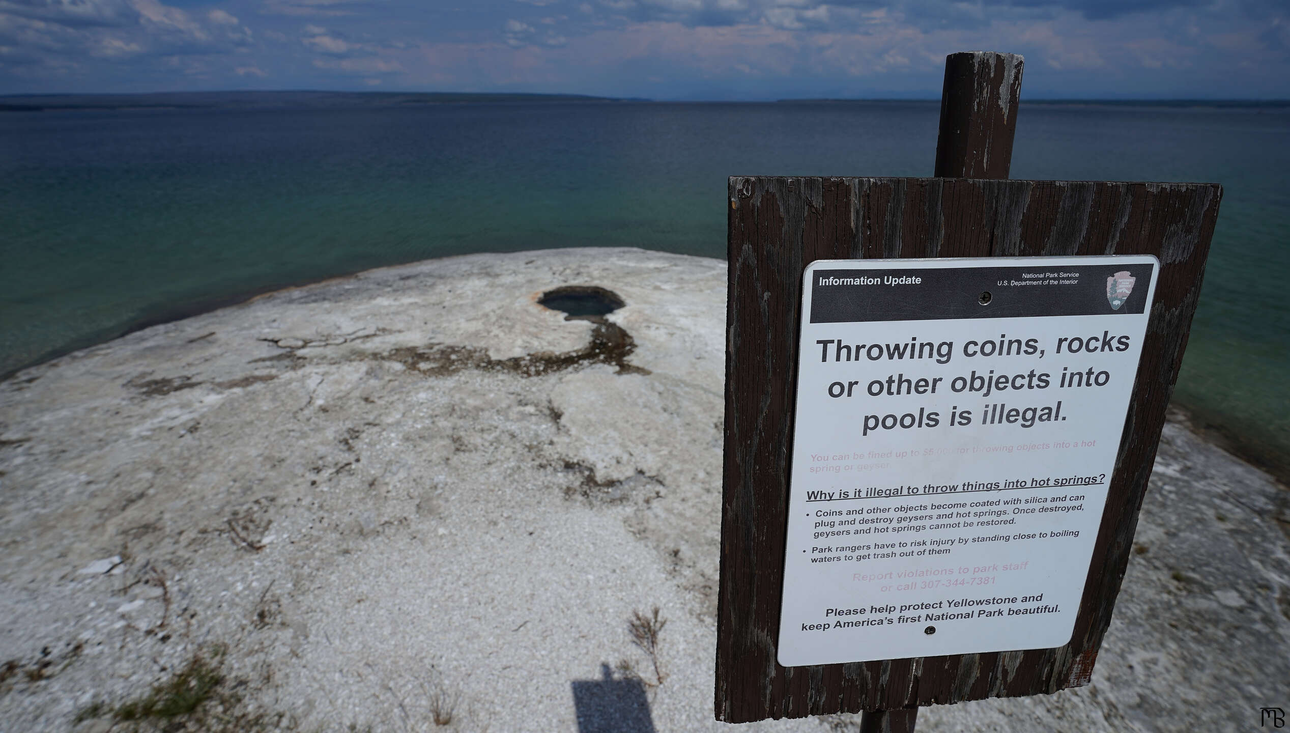 Sign telling folks not to throw things in geysers