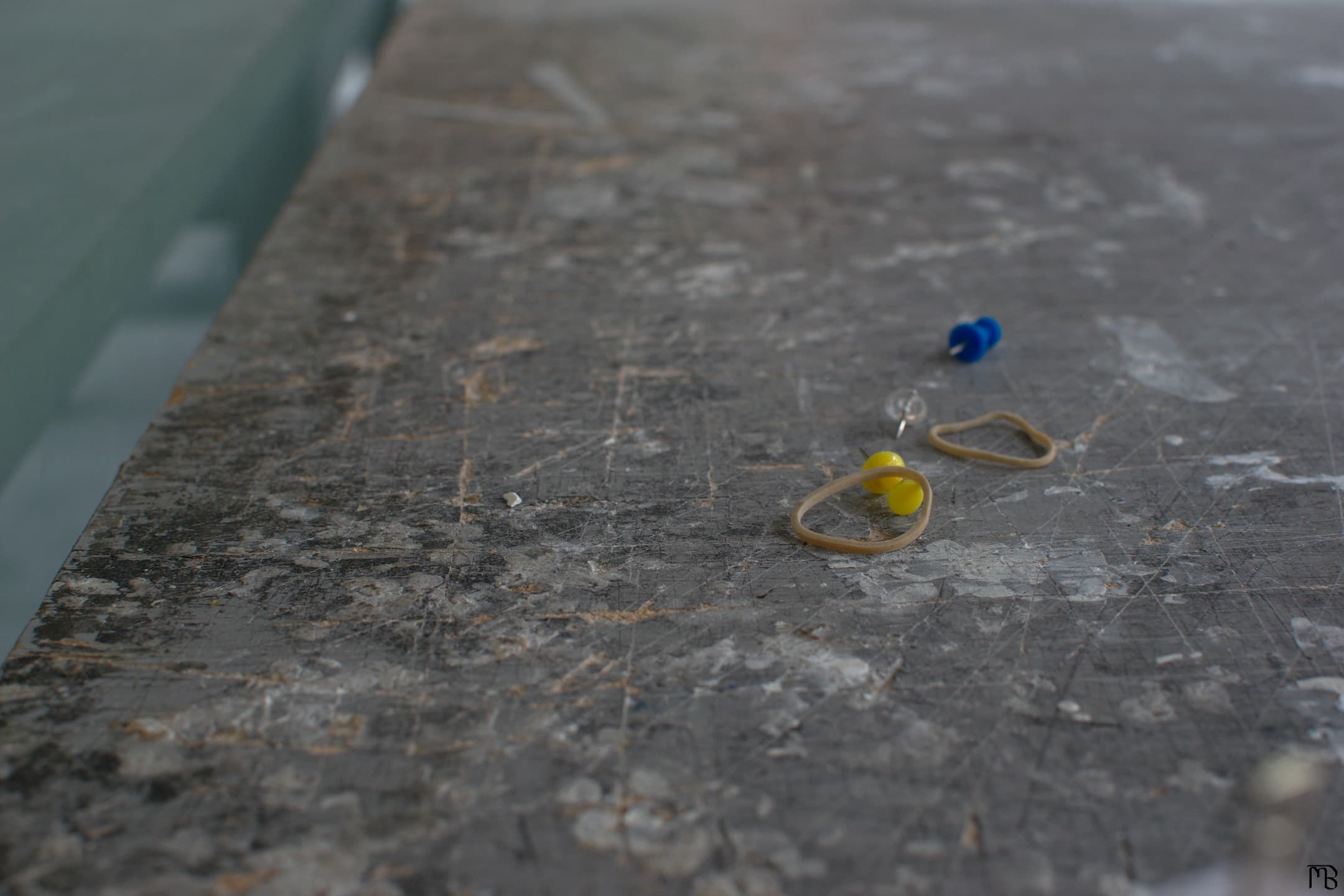 Thumbtacks on metal table