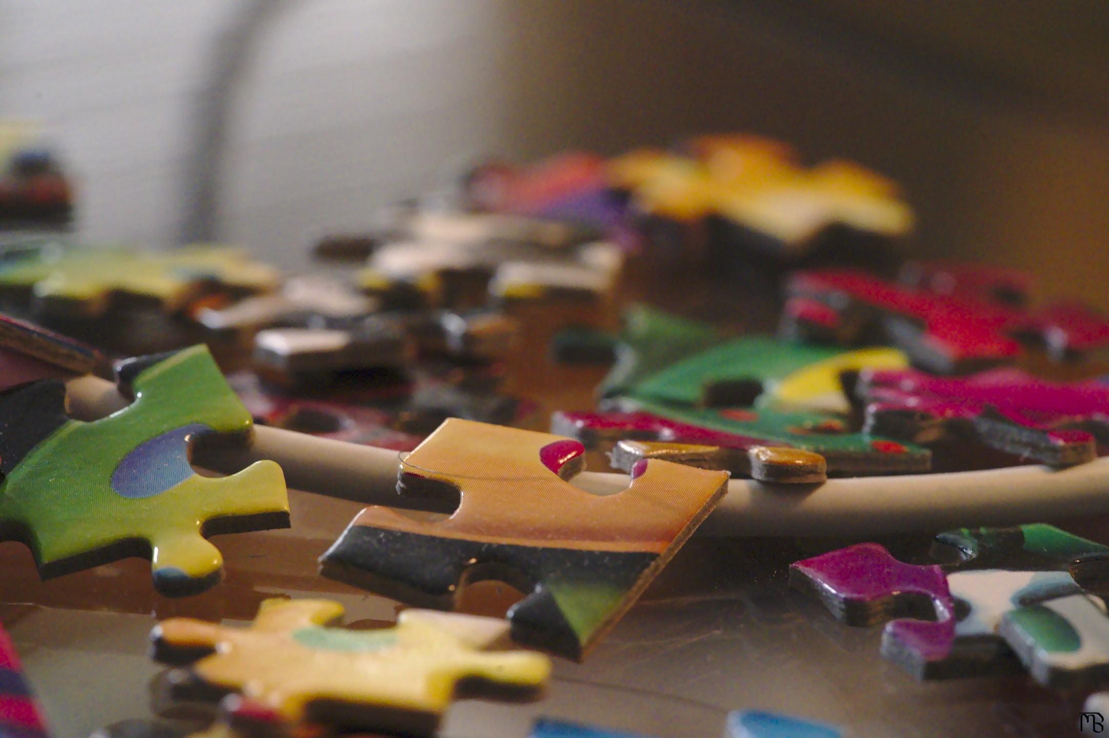 Puzzle pieces on glass table