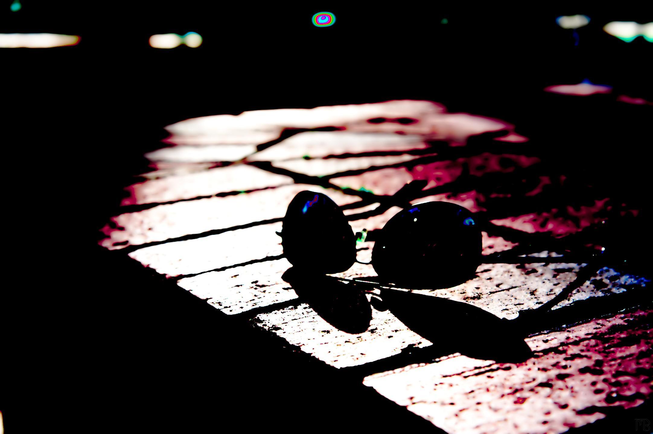 Arty sun glasses on brick