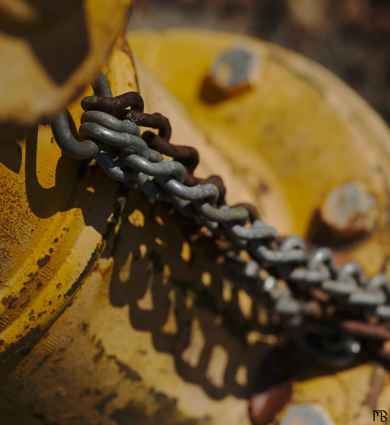 Chain on yellow fire-hydrant