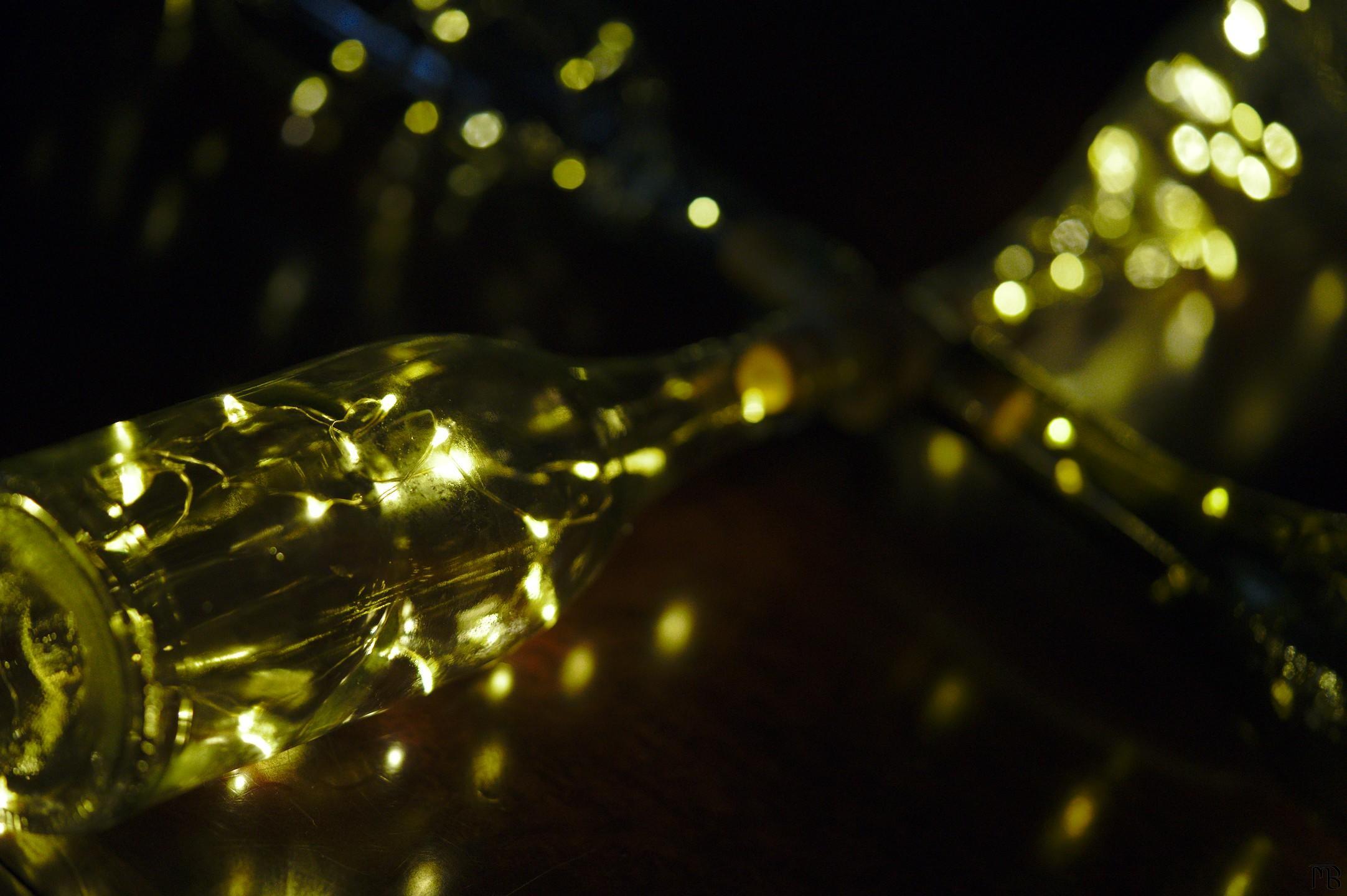 Four bottle lights in formation