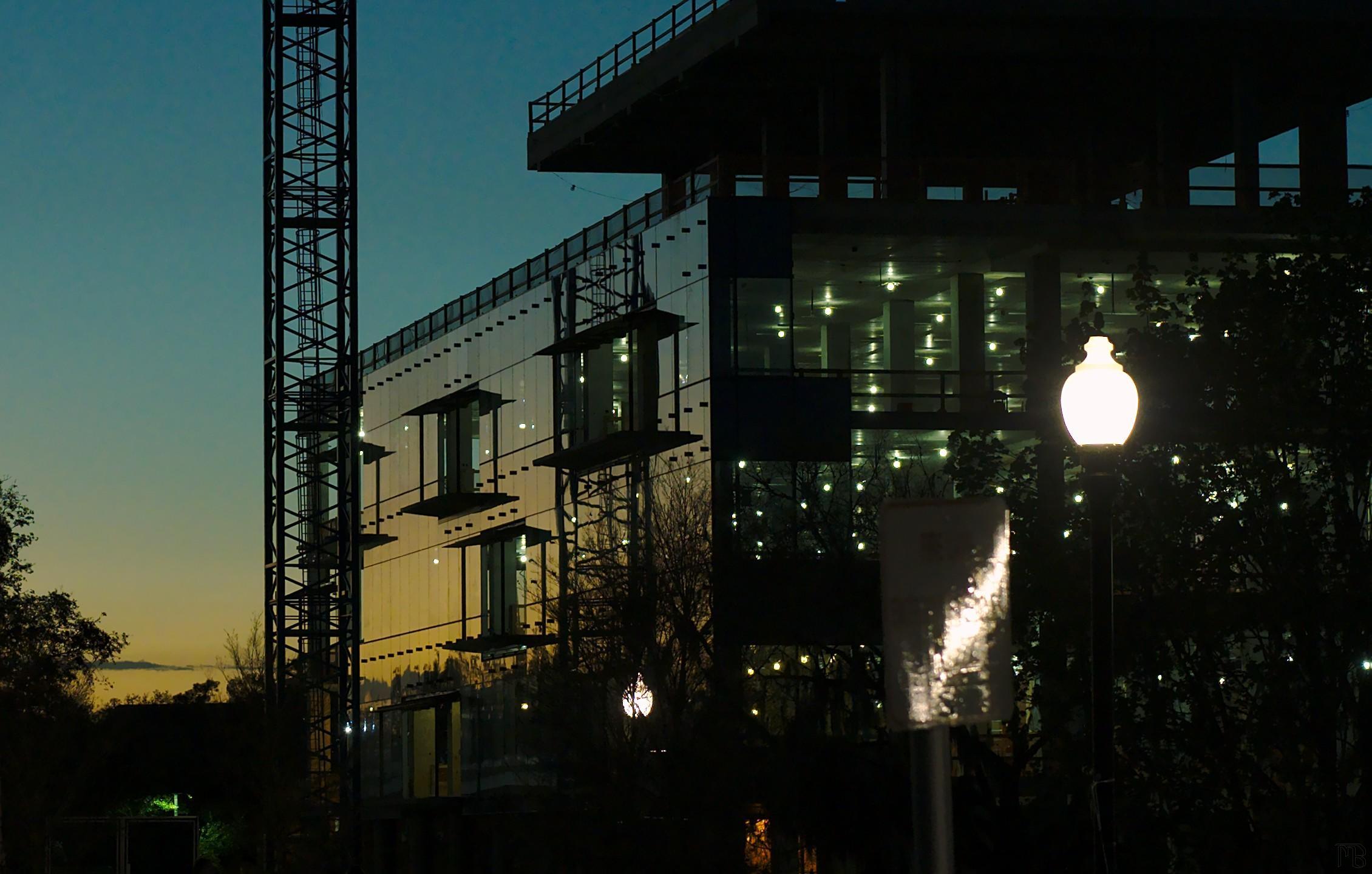 Blue and yellow sunset on mirrored building