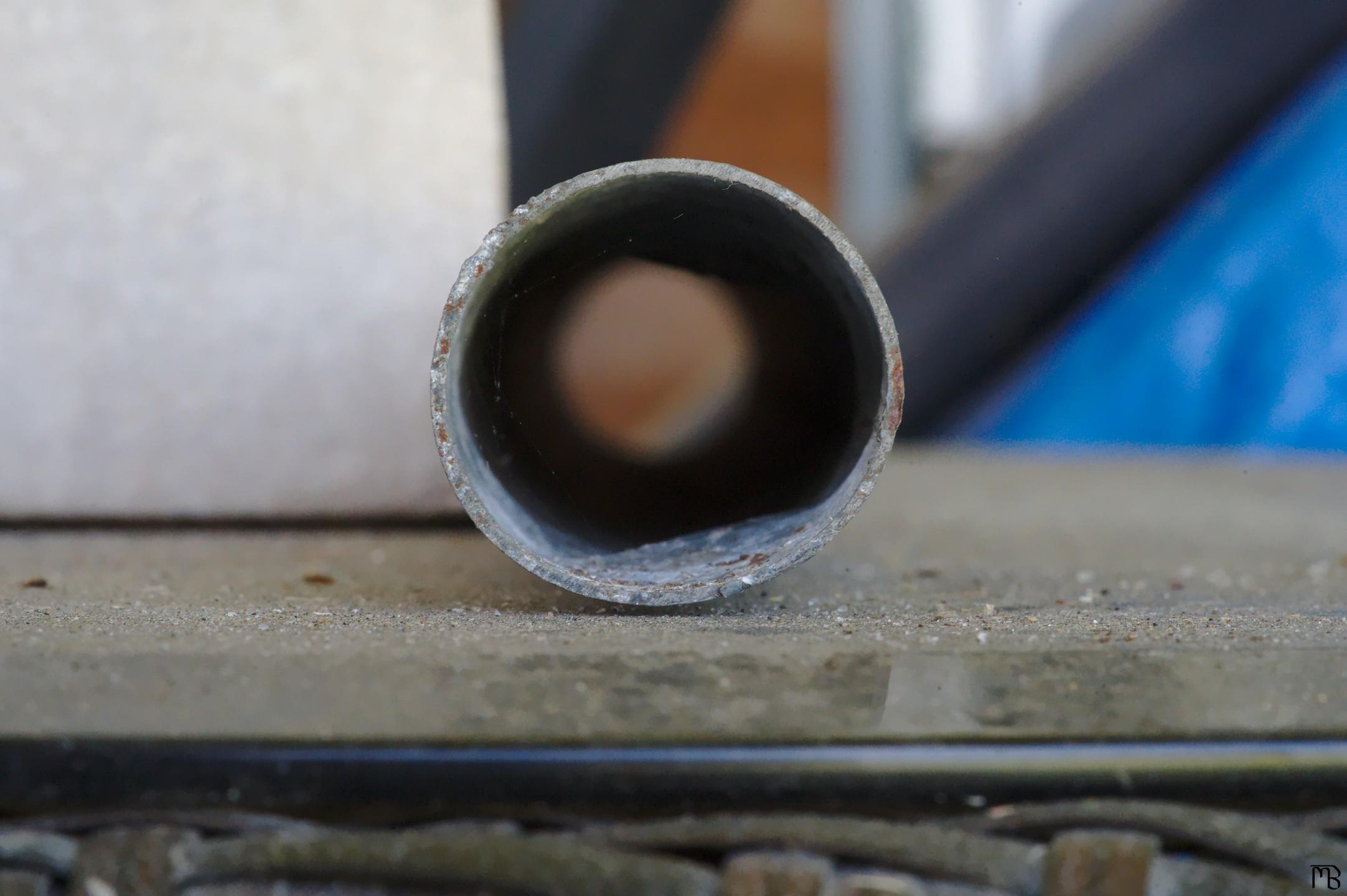 Metal pipe on glass table