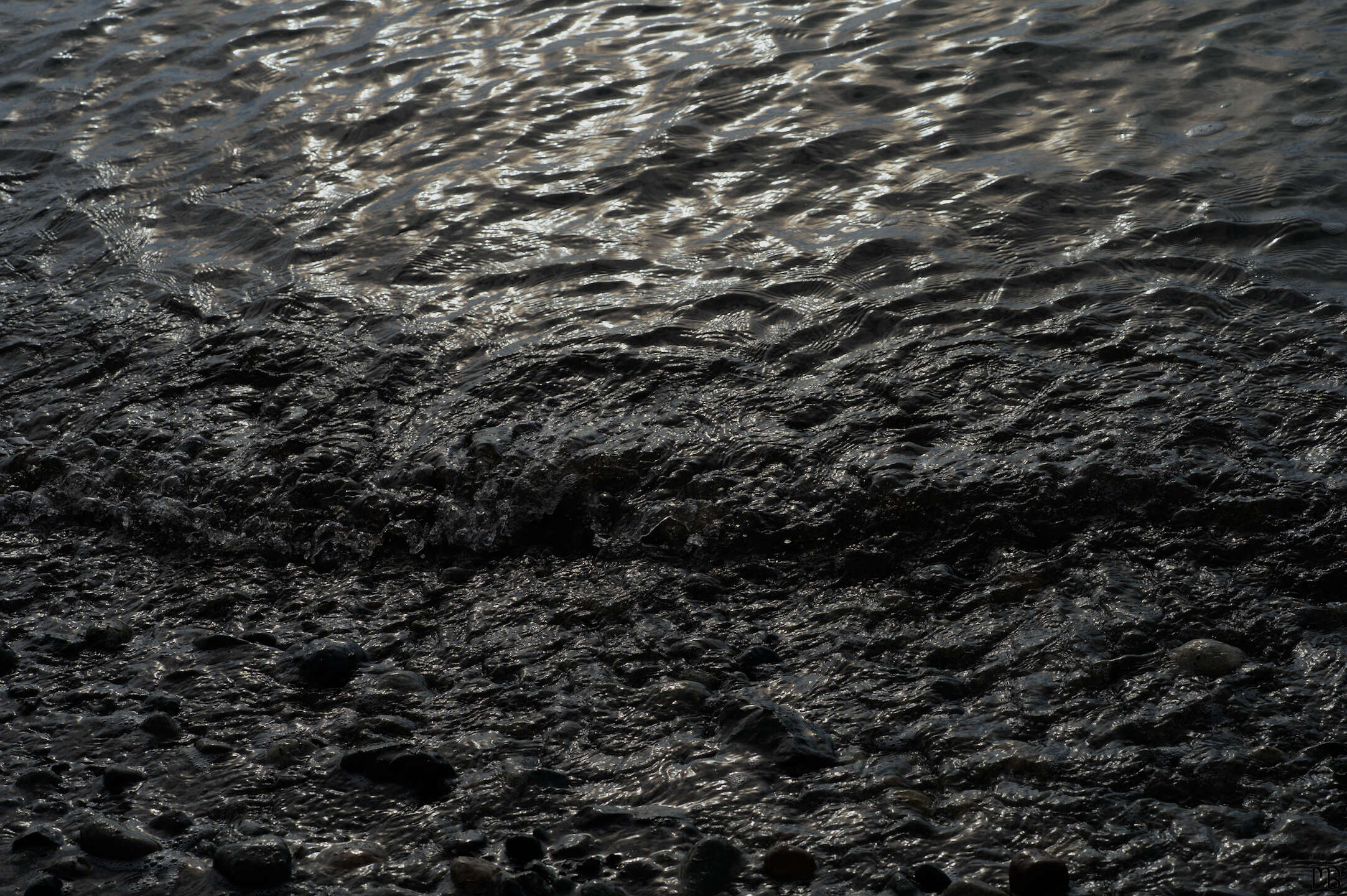 Gray water ripple at beach