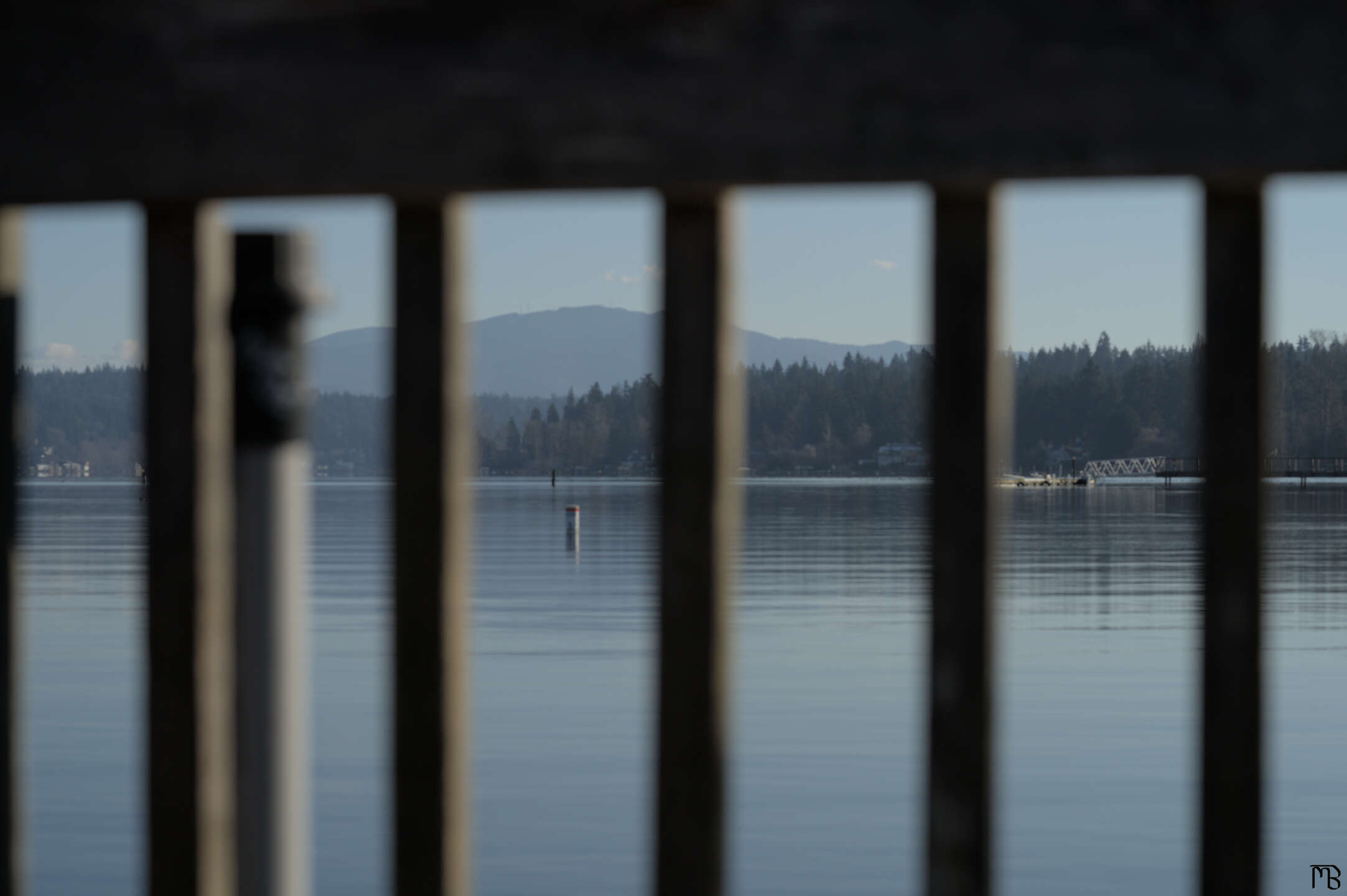 Floating buoy through wooden railing