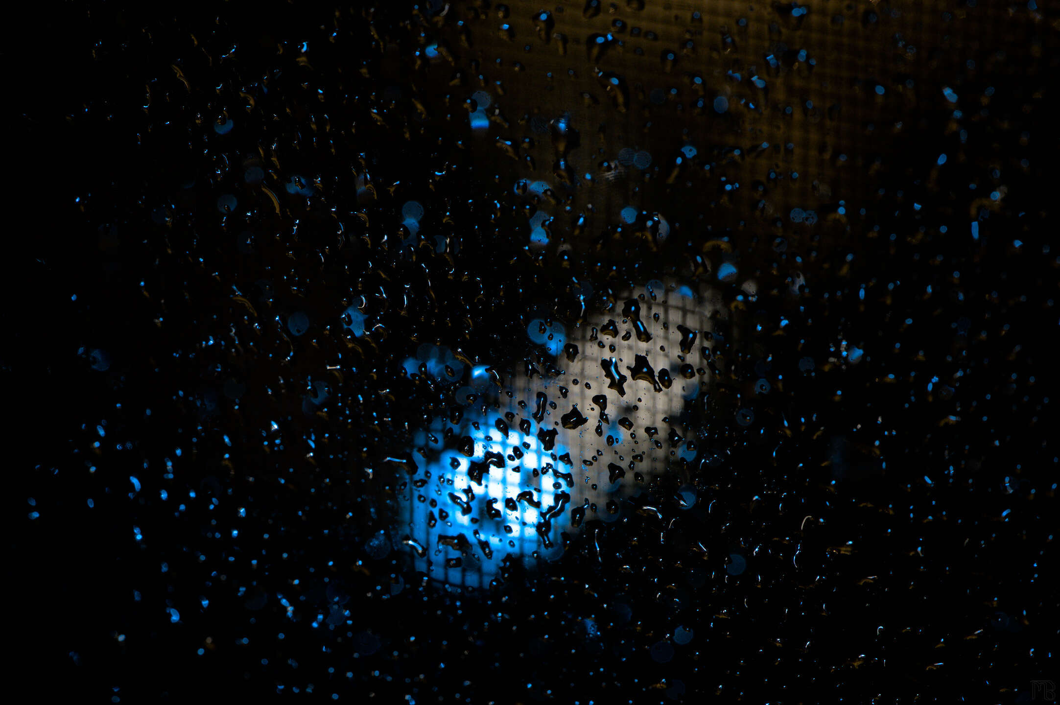 Blue light through raindrops