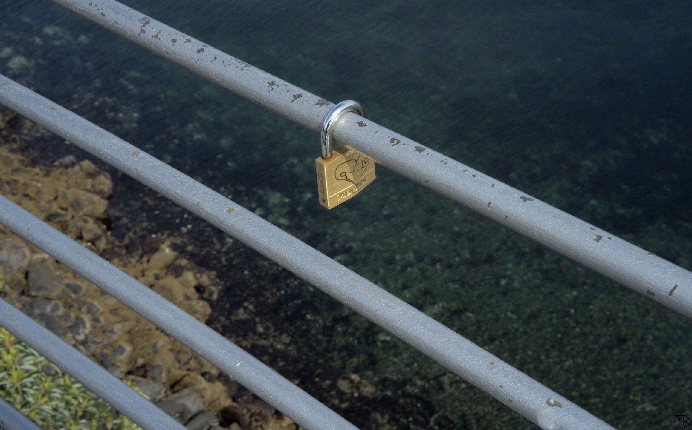 Lock above blue and green water