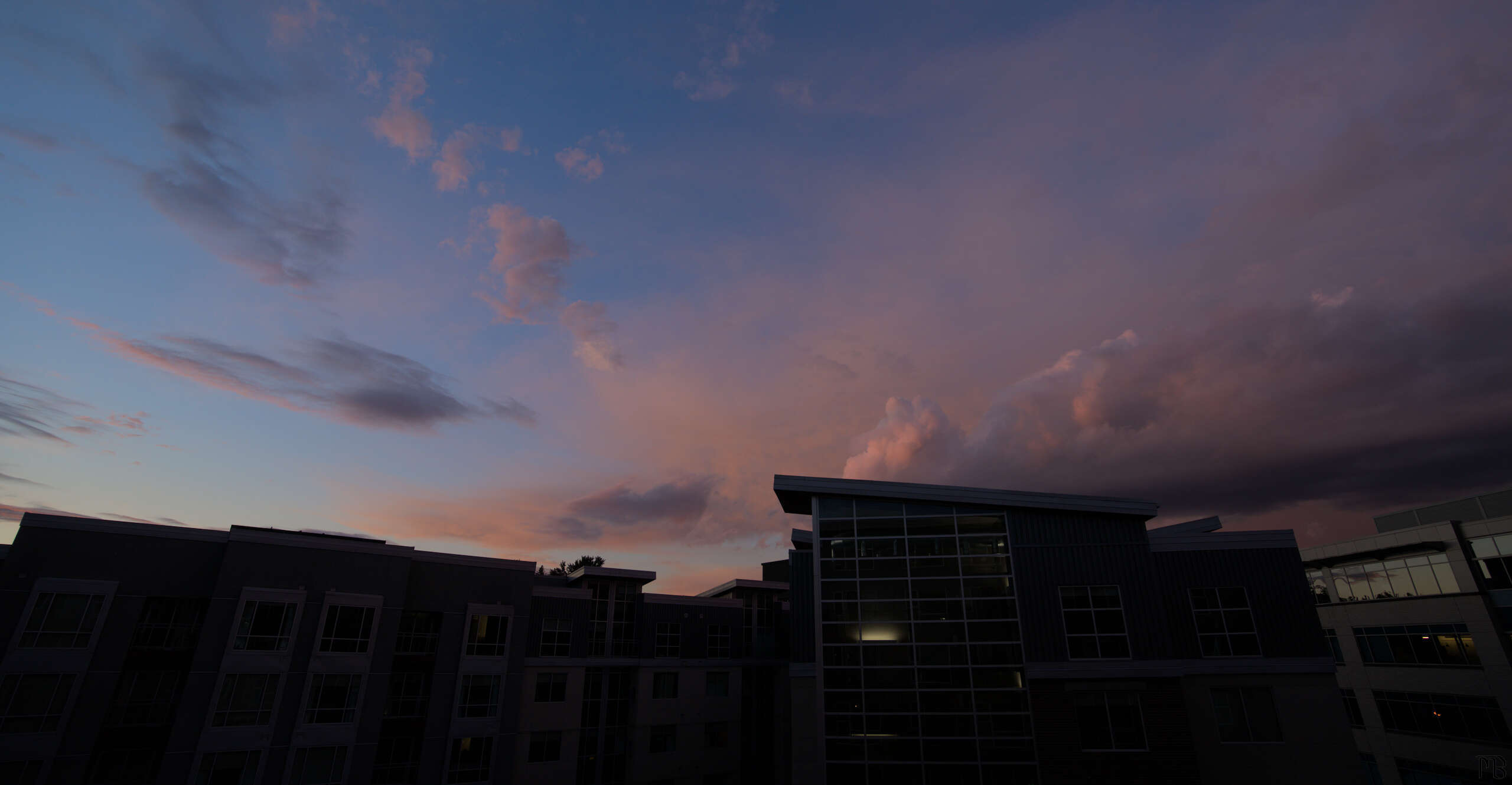 Blue and pink sky over a building