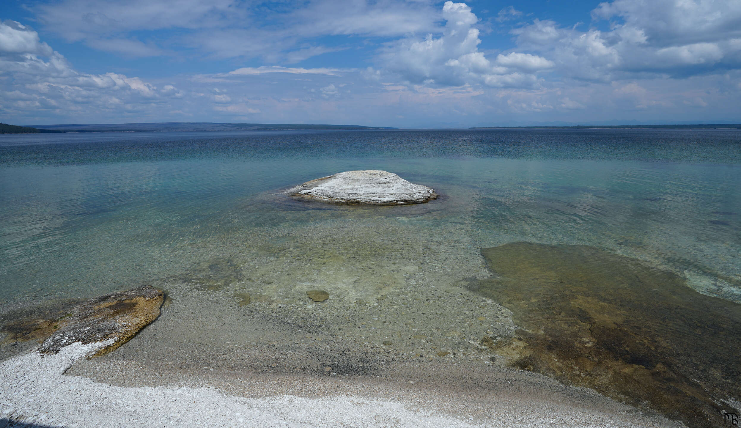 Rock floating above lake at Yellowstone