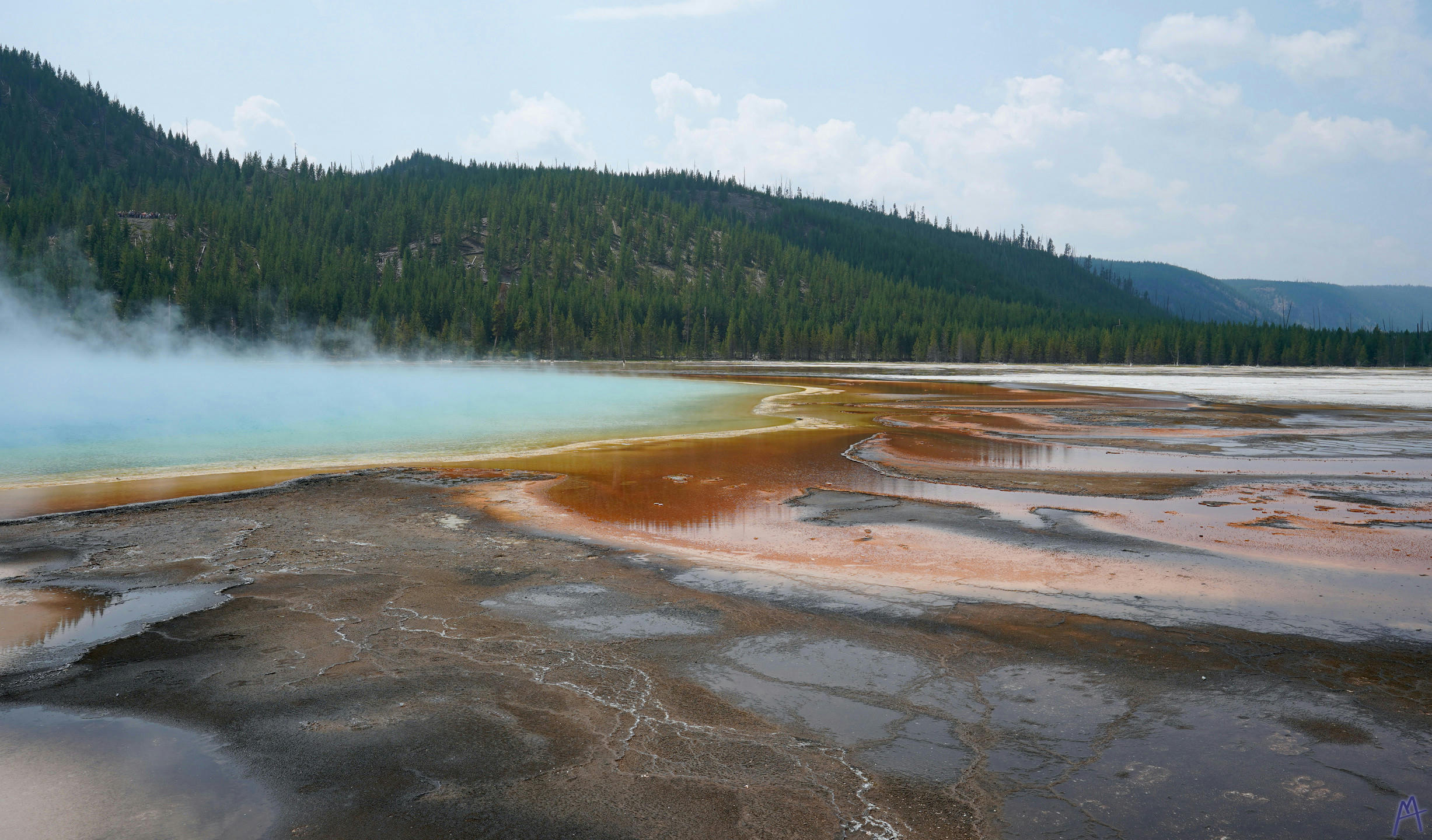 Orange runoff near blue hot spring at Yellowstone