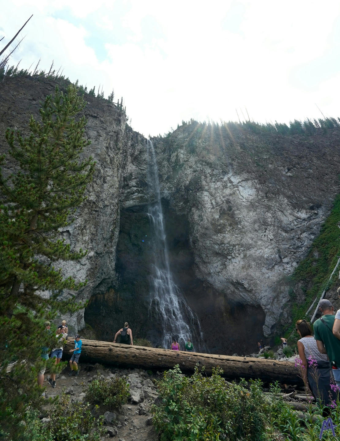 Sun peaking over the top of Fair Falls at Yellowstone