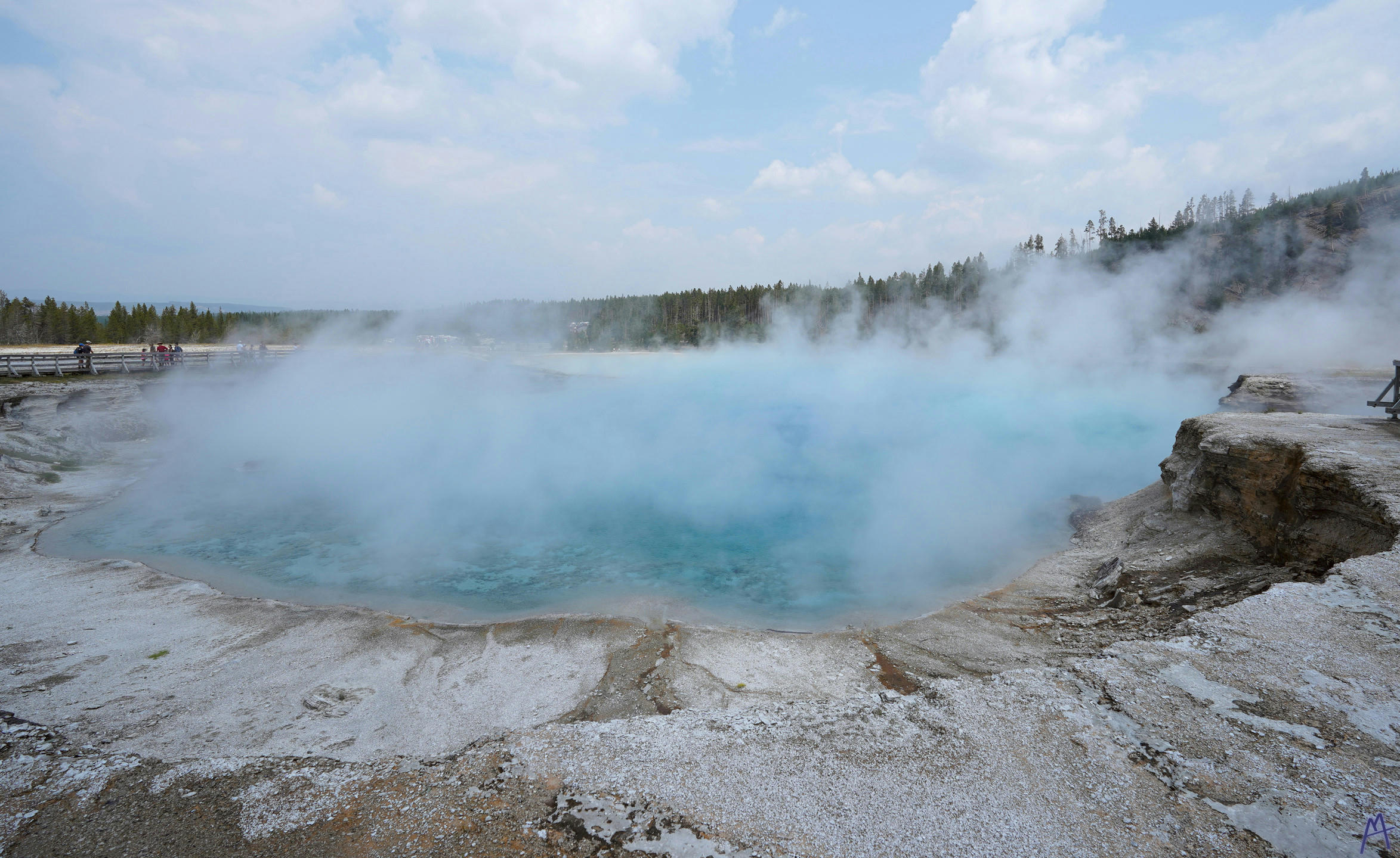 Cloud of steam from a very blue hot spring at Yellowstone