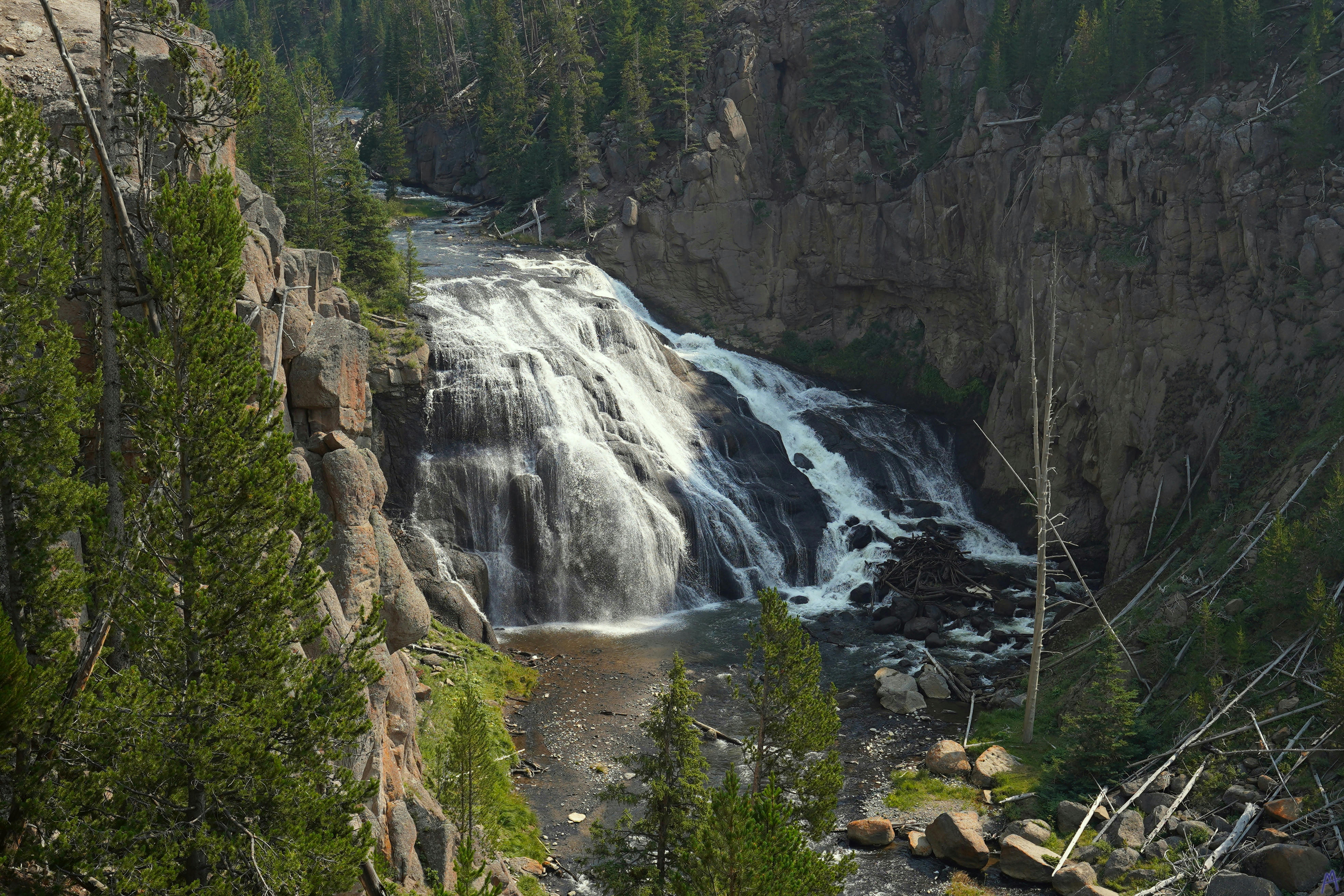 Large waterfall over rocks at Yellowstone