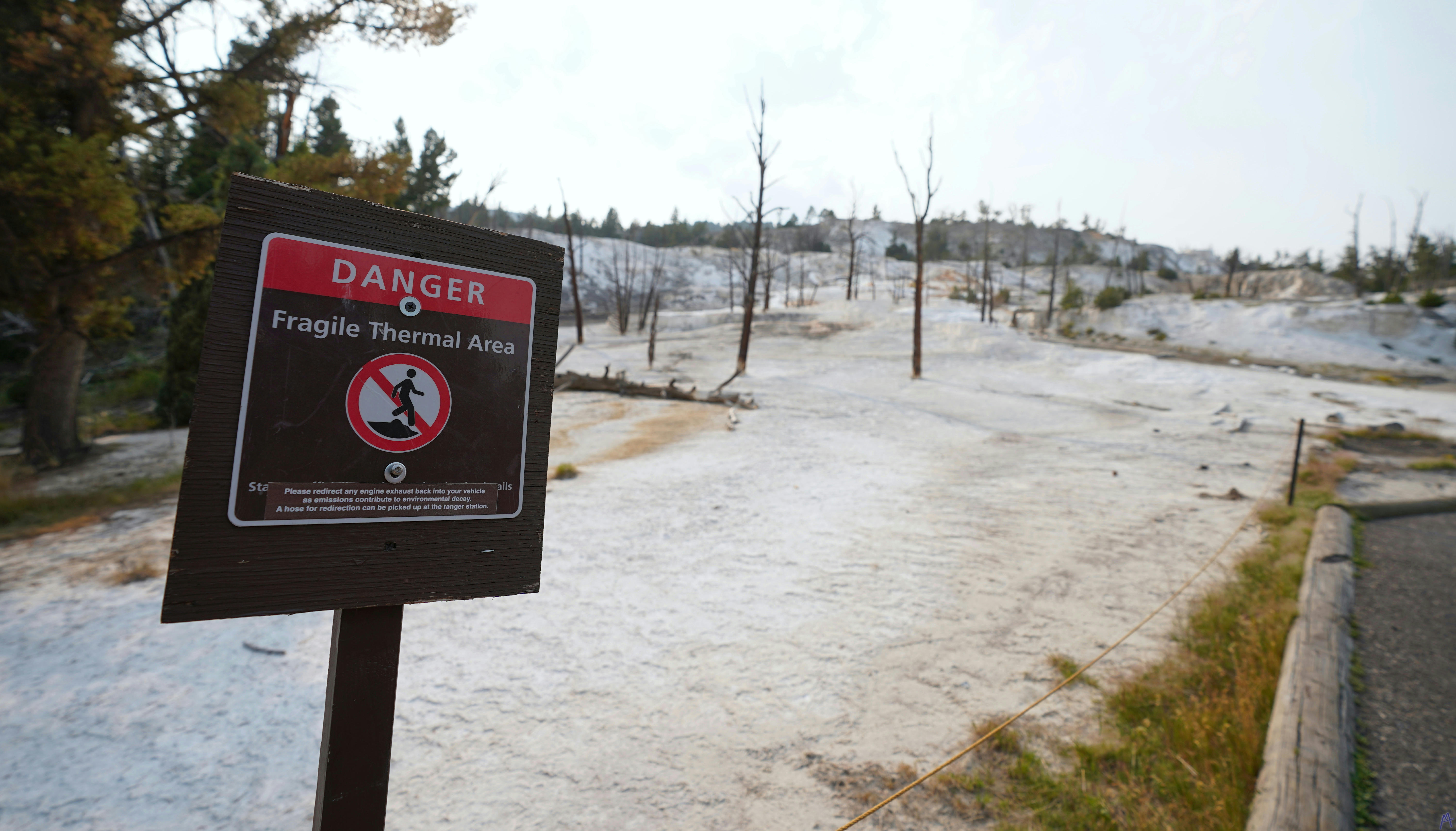 Danger sign about stark white thermal area at Yellowstone