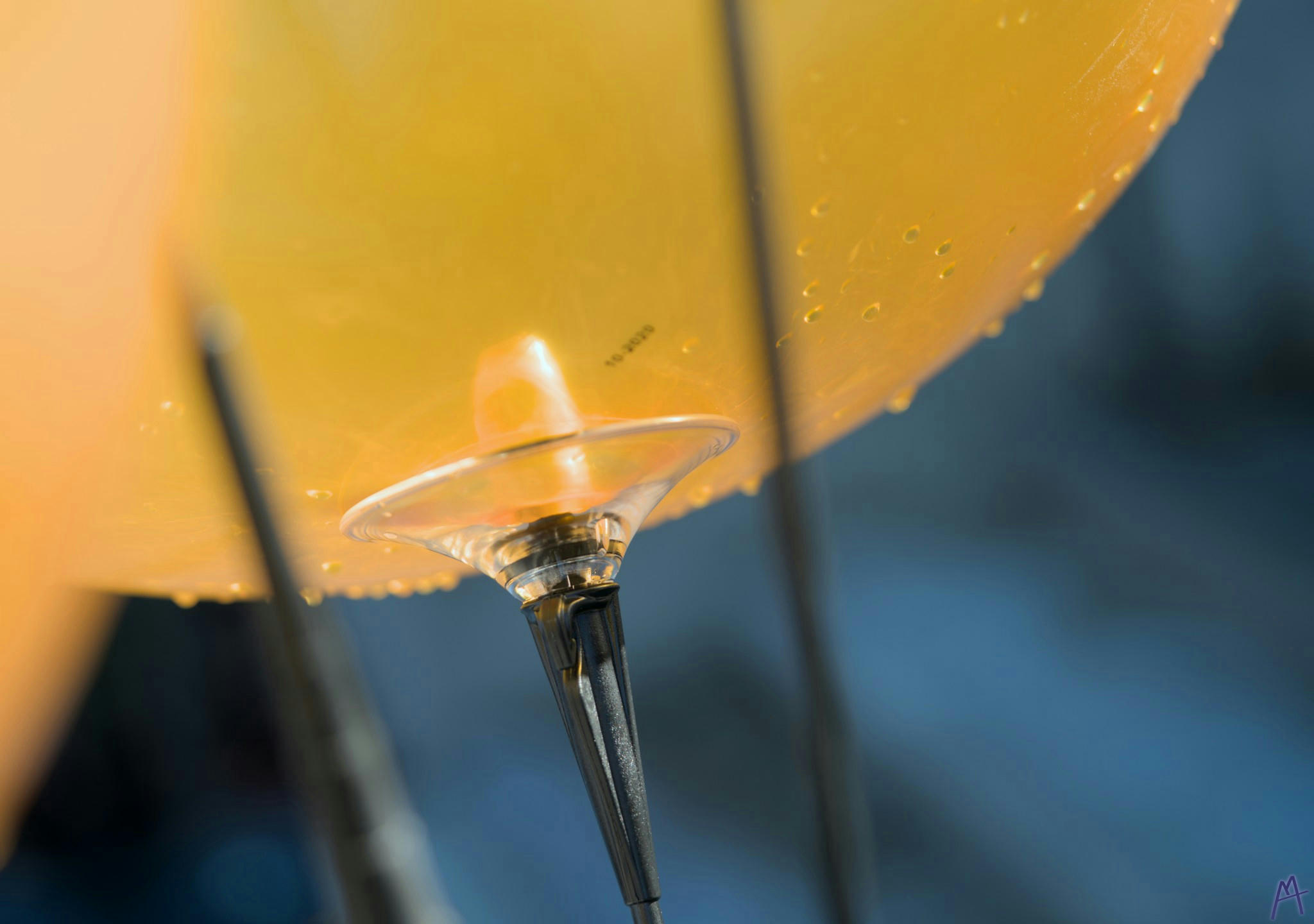 Yellow bulb with water beads