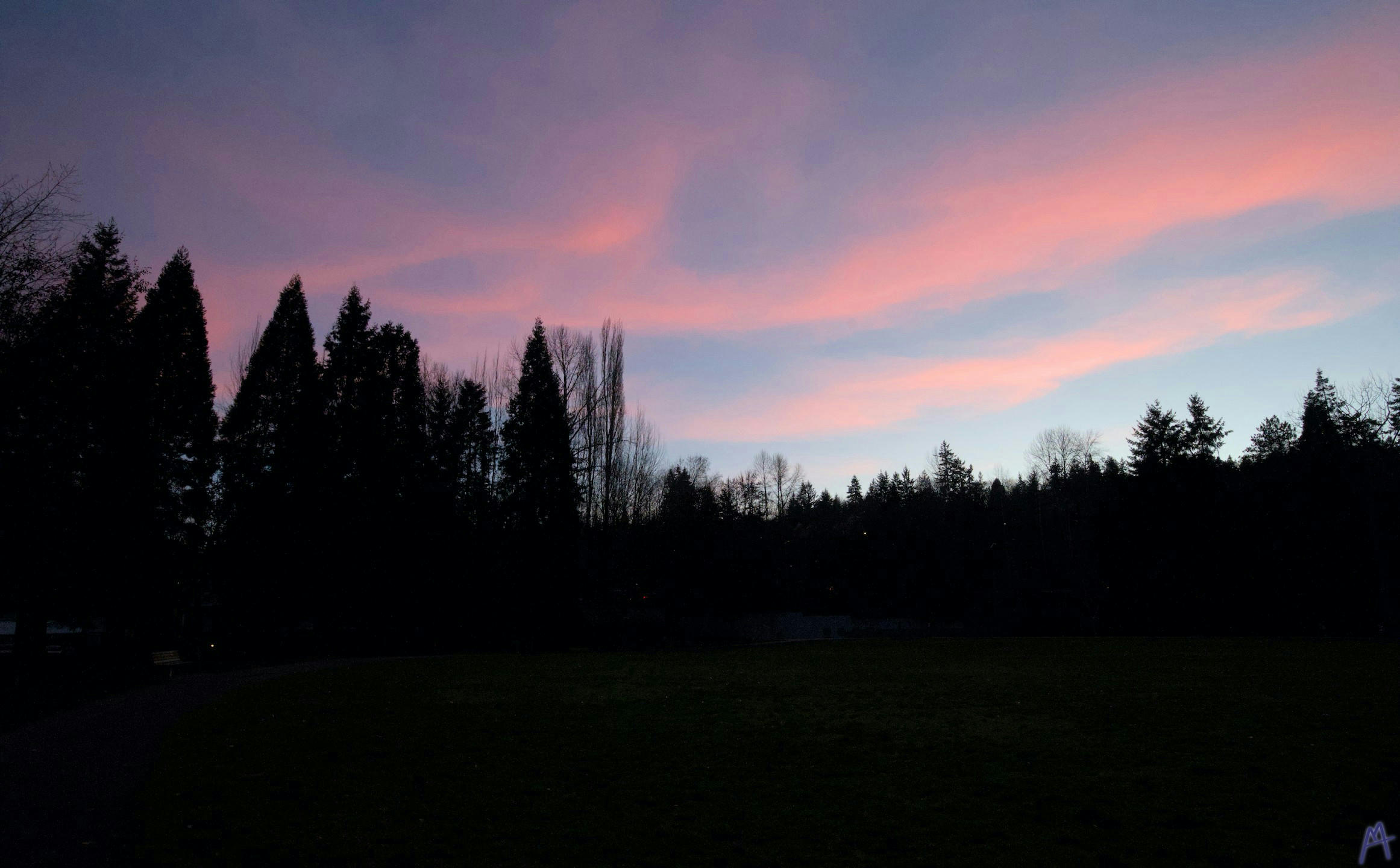 Blue and orange sunset with clouds in the sky