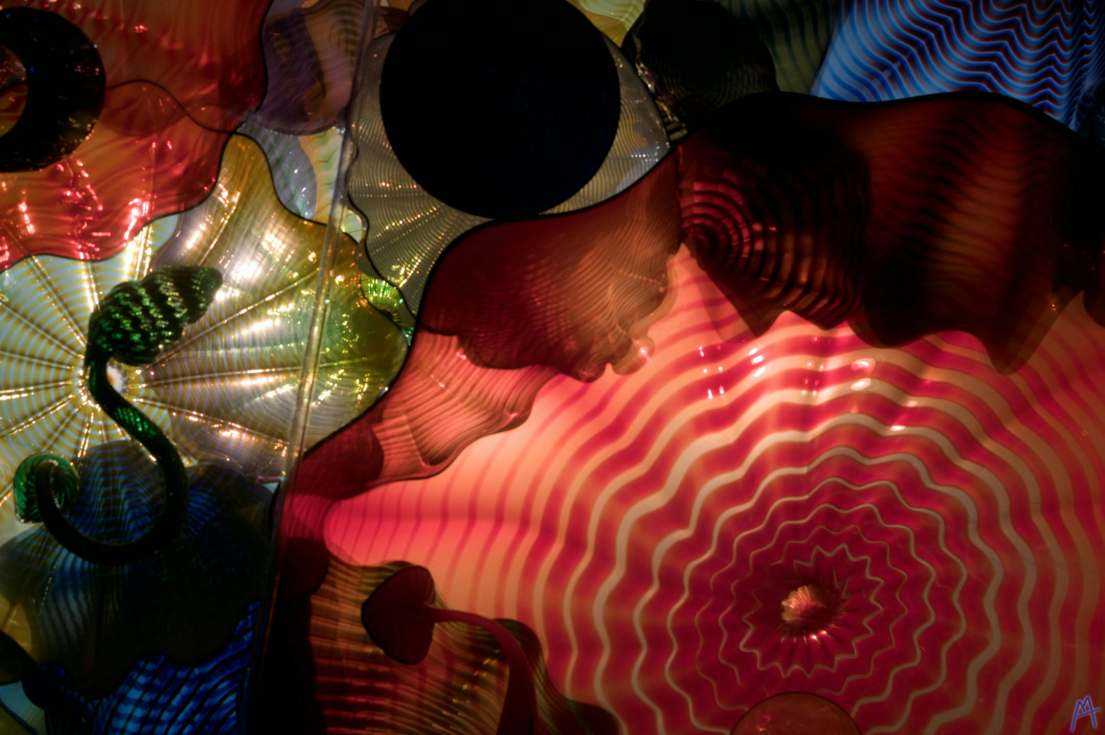 Red green and blue glass sculpture hanging above