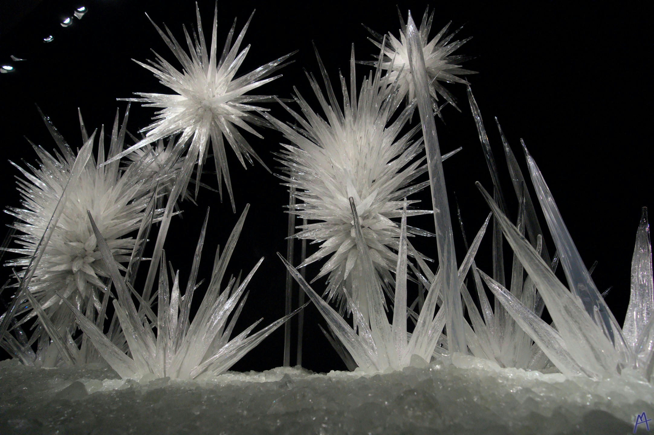 White glass spiky structures in the dark