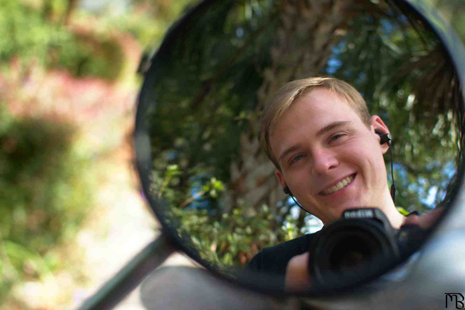 Matthew’s smile reflected on mirror