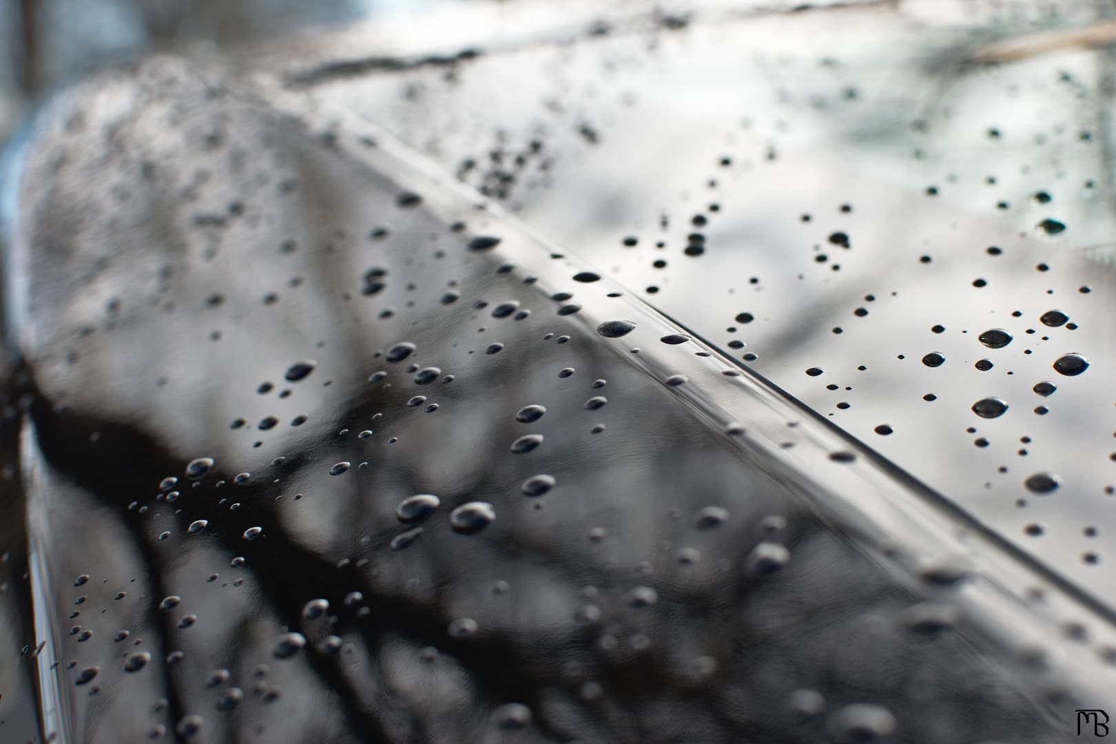 Water beads on car