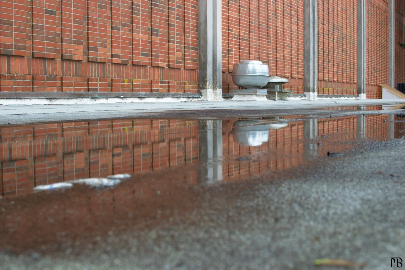 Brick wall reflecting on water