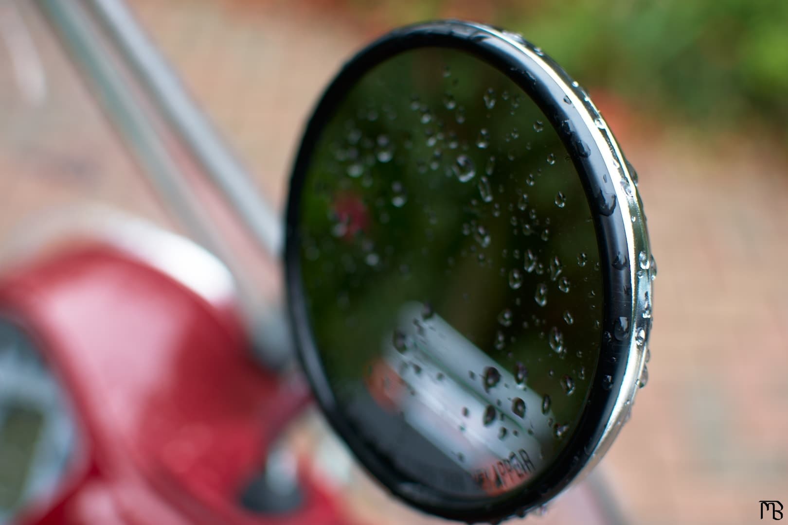 Water droplets on scooter mirror