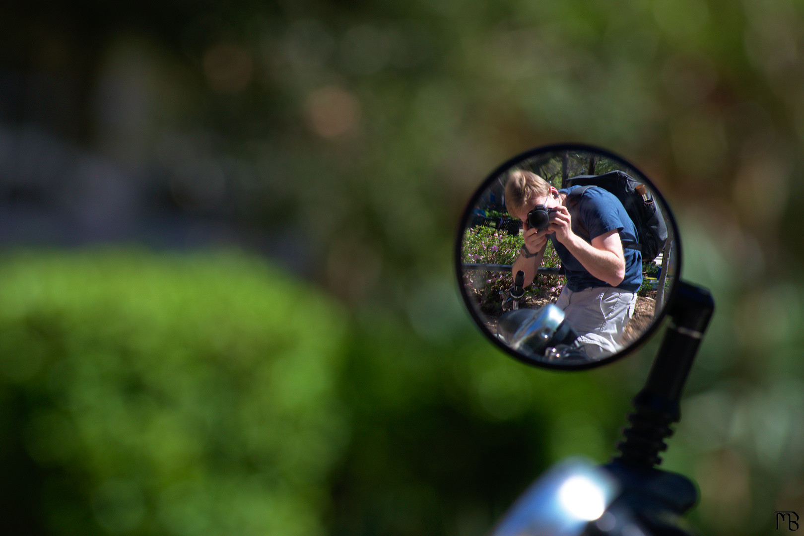 Me reflected on scooter mirror